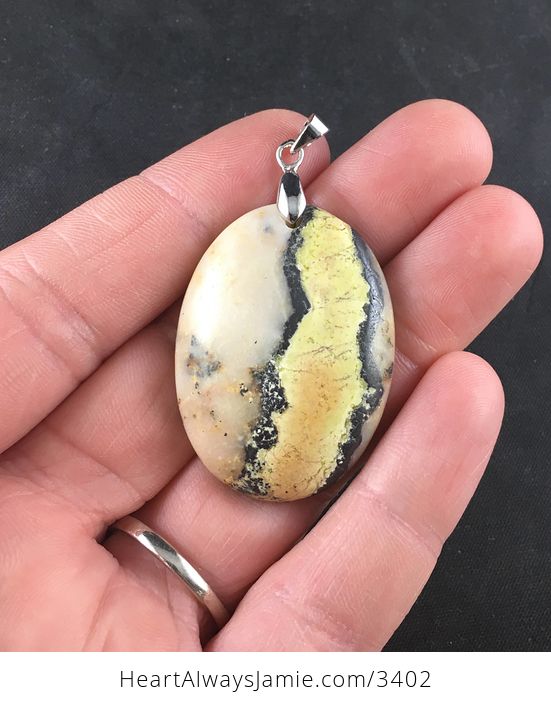 Oval Shaped Yellow Black and Beige Natural African Turquoise Stone Pendant - #RiPNghptzsM-1