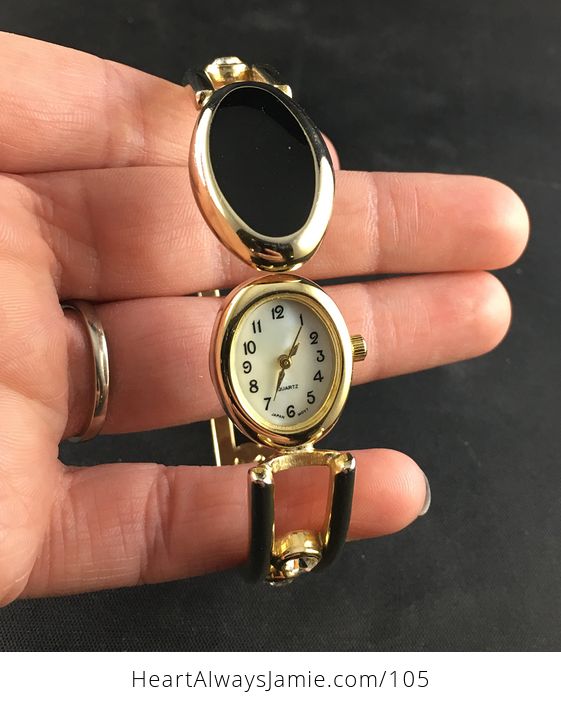 Vintage Quartz Wrist Watch with a Crystal Rhinestone Black and Gold Toned Bracelet and Peek a Boo Mother of Pearl Face - #9hyw7mafNYs-1